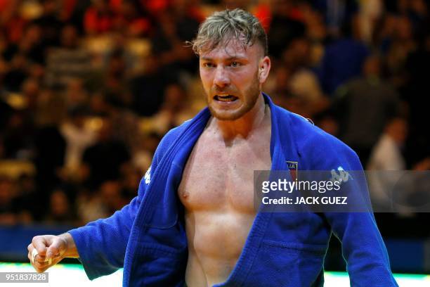 Italia's Antonio Esposito reacts after defeating Portugal's Anri Egutidze in the men's under 81 kg weight category quarter final match during the...