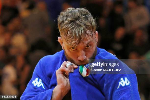 Italia's Antonio Esposito reacts after defeating Portugal's Anri Egutidze in the men's under 81 kg weight category quarter final match during the...