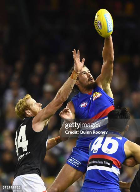 Tom Boyd of the Bulldogs competes in the ruck against Andrew Phillips of the Blues during the AFL round six match between the Western Bulldogs and...