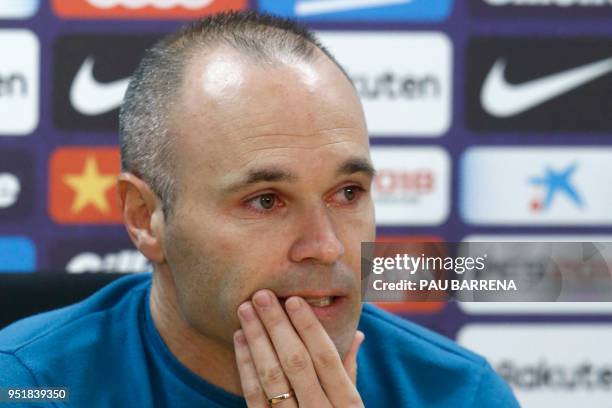 Barcelona's Spanish midfielder Andres Iniesta gives a press conference at the Joan Gamper Sports Center in Sant Joan Despi, near Barcelona, on April...