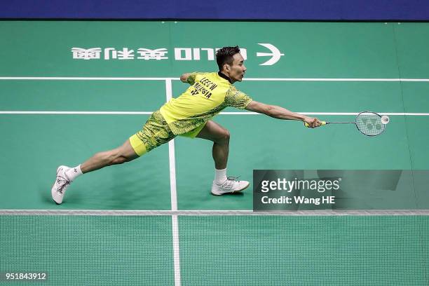 Lee Chong Wei of Malaysia hits a return during the men's singles match against Kidambi Srikanth of India at the 2018 Badminton Asia Championships on...