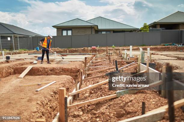 male worker working at construction site - foundation stock pictures, royalty-free photos & images