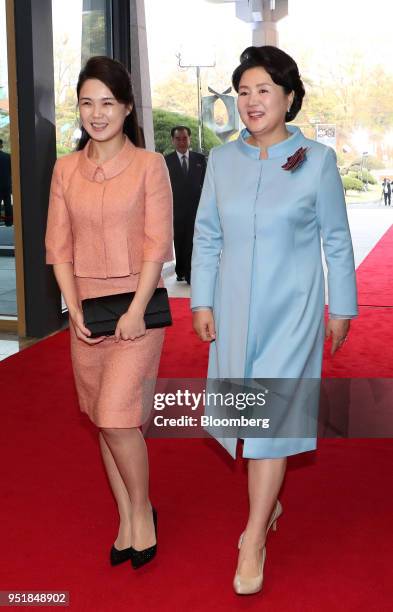 Kim Jung-sook, South Korea's first lady, right, and Ri Sol Ju, North Korea's first lady, arrive for a banquet during the inter-Korean summit at the...