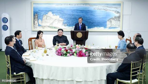 Moon Jae-in, South Korea's president, center, speaks as Ri Sol Ju, North Korea's first lady, fourth left, Kim Jong Un, North Korea's leader, fifth...