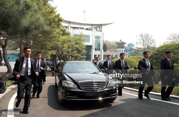 North Korean security escort a vehicle carrying Kim Jong Un, North Korea's leader, following the morning session of the inter-Korean summit in the...