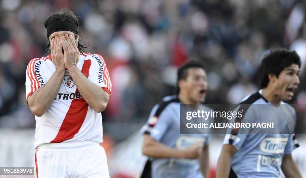River Plate's forward Mariano Pavone reacts after missing a penalty kick during the Argentina's Promotion football match against Belgrano, at...