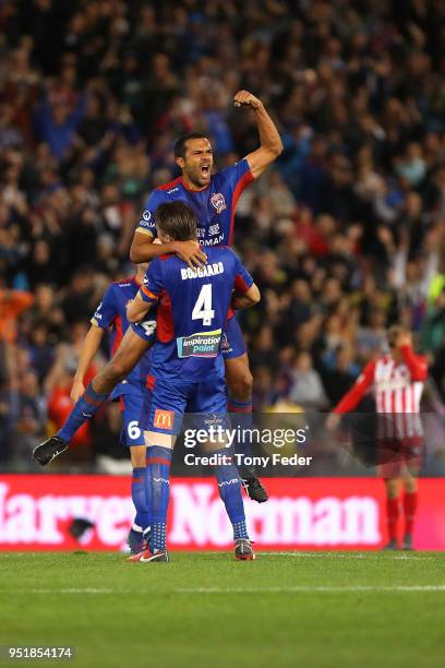 Nigel Boogaard and Nikolai Topor-Stanley of the Jets celebrate after defeating Melbourne City during the A-League Semi Final match between the...