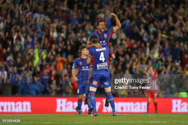 Nigel Boogaard and Nikolai Topor-Stanley of the Jets celebrate after defeating Melbourne City during the A-League Semi Final match between the...