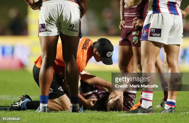 Lachlan Crocker of the Sea Eagles lays down injured during the Round eight NRL match between the Manly-Warringah Sea Eagles and the Newcastle Knights...
