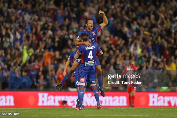 Nigel Boogaard and Nikolai Topor-Stanley of the Jets celebrate after defeating Melbourne City during the A-League Semi Final match between the...