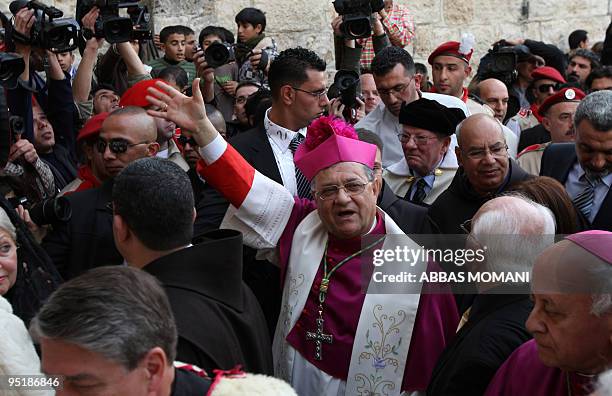 The head of the Roman Catholic Church in the Holy Land, the Latin Patriarch of Jerusalem Fuad Twal , arrives at the Church of the Nativity, believed...