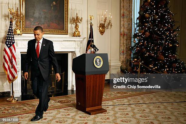 President Barack Obama walks away from the podium in the State Department after delivers remarks after the Senate passed their version of health care...