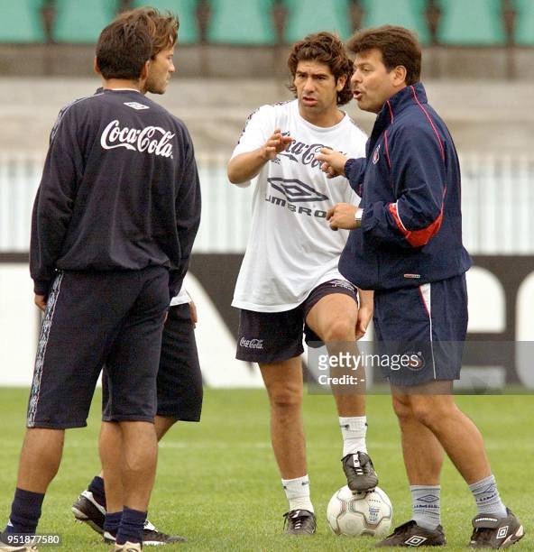Soccer players on the chilean team, George Garces , and Marcelo Salas talk during training in the Couto Pereira Stadium in Curitiba, in south Brazil,...