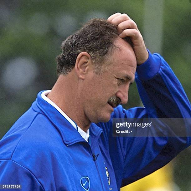 Louis Phillip Scolari, coach of the brazilian soccer team, scratches his head, 06 October 2001, during a practice in the Central Paranaense Athletic...