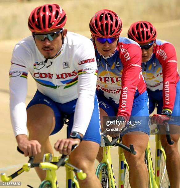 French cyclists Arnaud Tournant , Arnaud Duble and Laurent Gane , train in the Alto Irpavi velodrome in La Paz, Bolivia 08 October, 2001. The...