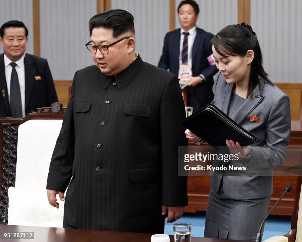 North Korean leader Kim Jong Un , alongside Kim Yo Jong, his sister and a senior official of the ruling Workers' Party, attends a meeting with South...