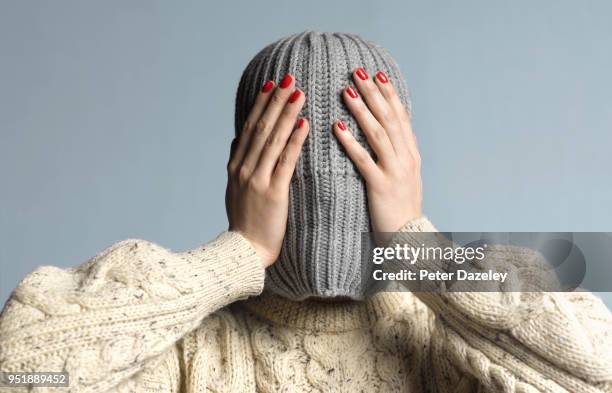 girl with bipolar under hat - fobia imagens e fotografias de stock