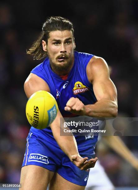 Tom Boyd of the Bulldogs handballs during the AFL round six match between the Western Bulldogs and Carlton Blues at Etihad Stadium on April 27, 2018...