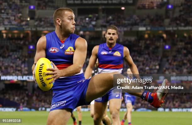 Caleb Daniel of the Bulldogs in action without his trademark helmet during the 2018 AFL round six match between the Western Bulldogs and the Carlton...