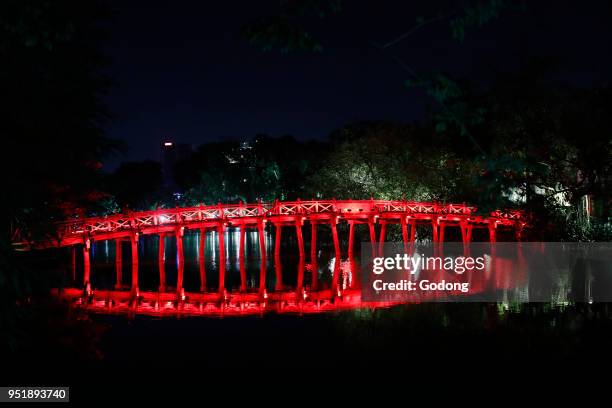 Huc Bridge on Hoan Kiem Lake at night. Hanoi, Vietnam.