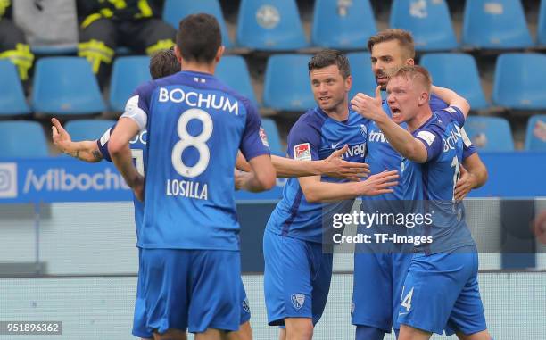 Lukas Hinterseer of Bochum celebrates after scoring his team`s first goal with Tim Hoogland of Bochum and Philipp Ochs of Bochum during the Second...