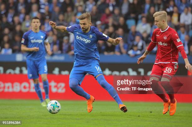 Lukas Hinterseer of Bochum and Nils Seufert of Kaiserslautern battle for the ball during the Second Bundesliga match between VfL Bochum 1848 and 1....