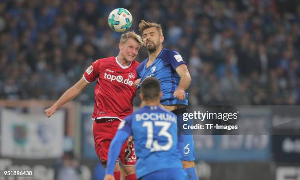 Jan-Ingwer Callsen-Bracker of Kaiserslautern and Lukas Hinterseer of Bochum battle for the ball during the Second Bundesliga match between VfL Bochum...