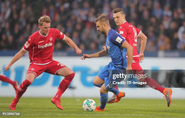 Jan-Ingwer Callsen-Bracker of Kaiserslautern and Lukas Hinterseer of Bochum battle for the ball and Gino Fechner of Kaiserslautern during the Second...