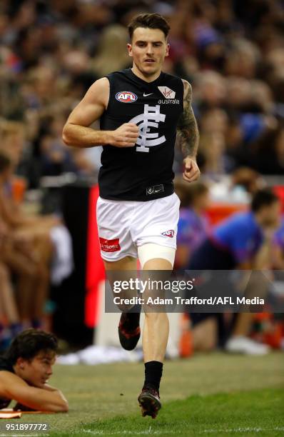 Aaron Mullett of the Blues tests an injury on the boundary line during the 2018 AFL round six match between the Western Bulldogs and the Carlton...