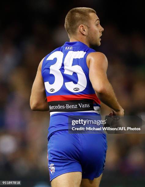 Caleb Daniel of the Bulldogs looks on without his helmet during the 2018 AFL round six match between the Western Bulldogs and the Carlton Blues at...