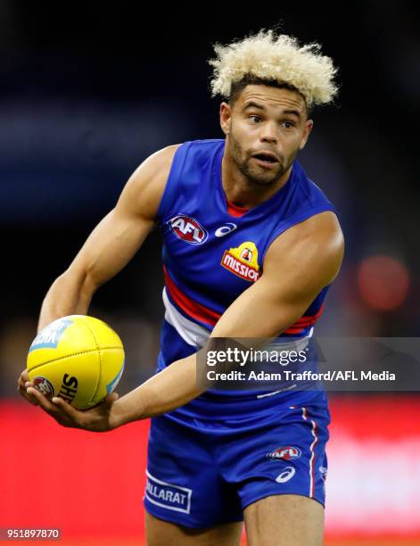 Jason Johannisen of the Bulldogs handpasses the ball during the 2018 AFL round six match between the Western Bulldogs and the Carlton Blues at Etihad...