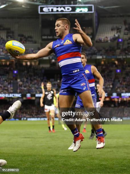 Caleb Daniel of the Bulldogs in action without his trademark helmet during the 2018 AFL round six match between the Western Bulldogs and the Carlton...