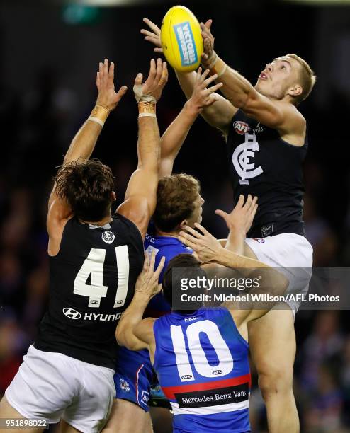 Harry McKay of the Blues and Levi Casboult of the Blues compete for the ball against Easton Wood of the Bulldogs during the 2018 AFL round six match...