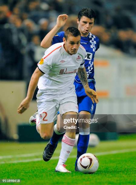 Lille's Mathieu Debuchy and Gent's Stijn De Smet fight for the ball during the first leg of the UEFA Europa League group stage match AA Gent vs OSC...