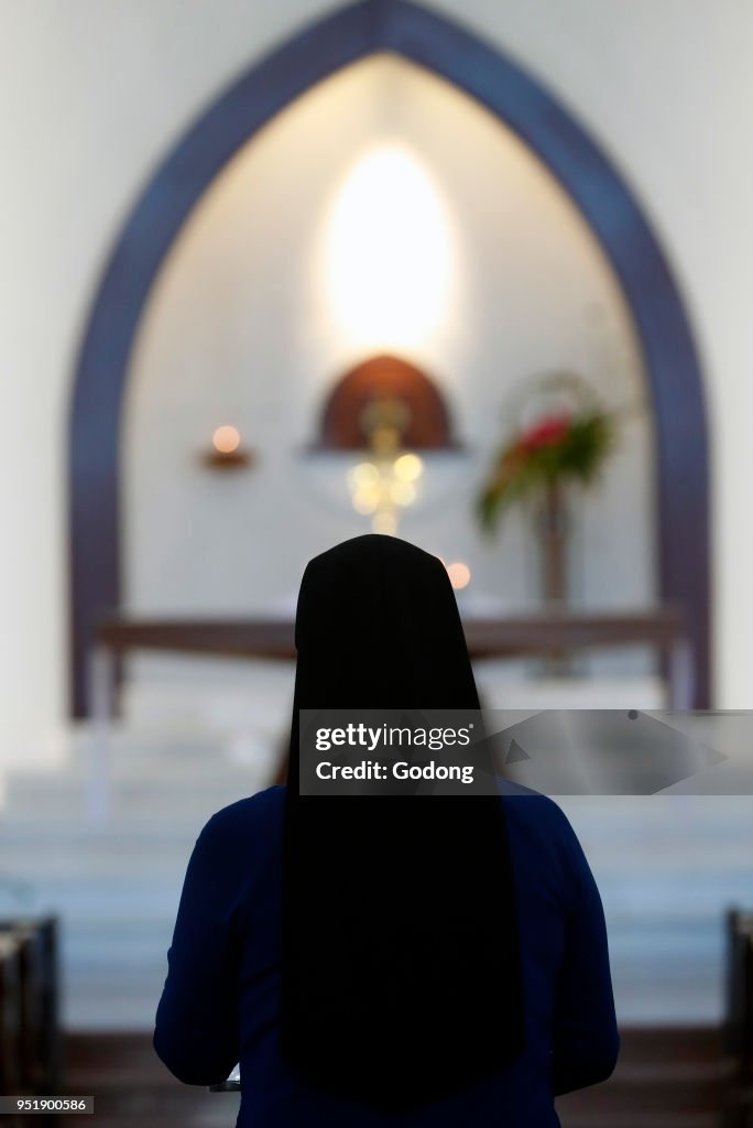 Catholc sister at service.