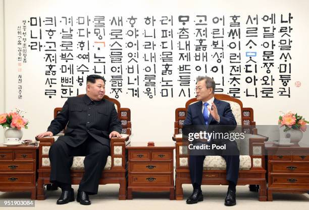 North Korean leader Kim Jong Un and South Korean President Moon Jae-in are in talks during the Inter-Korean Summit on April 27, 2018 in Panmunjom,...
