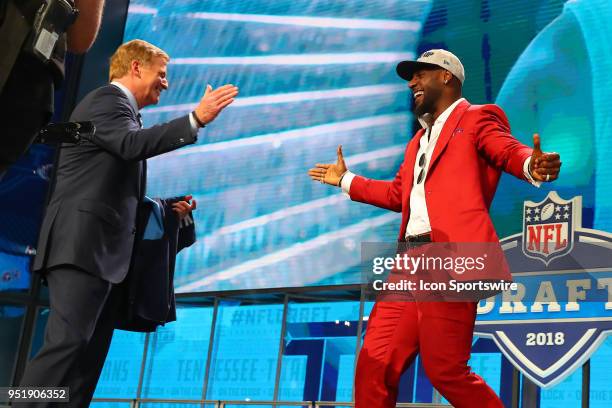 Rashaan Evans shakes hands with NFL Commissioner Roger Goodell after being chosen by the Tennessee Titans with the 22nd pick during the first round...