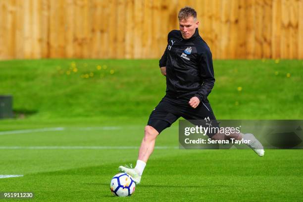 Matt Ritchie strikes the ball during the Newcastle United Training Session at the Newcastle United Training Centre on April 27 in Newcastle upon...