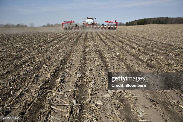 Case IH Agricultural Equipment Inc. Tractor pulls a planter through a field as corn is planted in Princeton, Illinois, U.S., on Tuesday, April 24,...