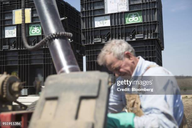 DuPont Pioneer logos are displayed on a bulk seed bin as corn seed is loaded into a Case IH Agricultural Equipment Inc. Planter in Princeton,...