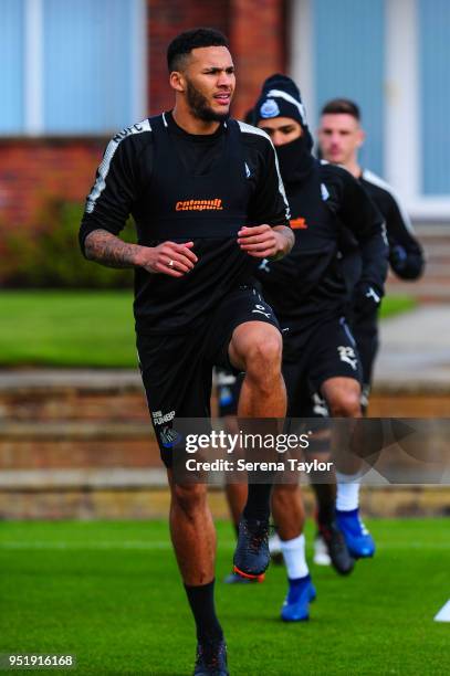 Jamaal Lascelles warms up during the Newcastle United Training Session at the Newcastle United Training Centre on April 27 in Newcastle upon Tyne,...