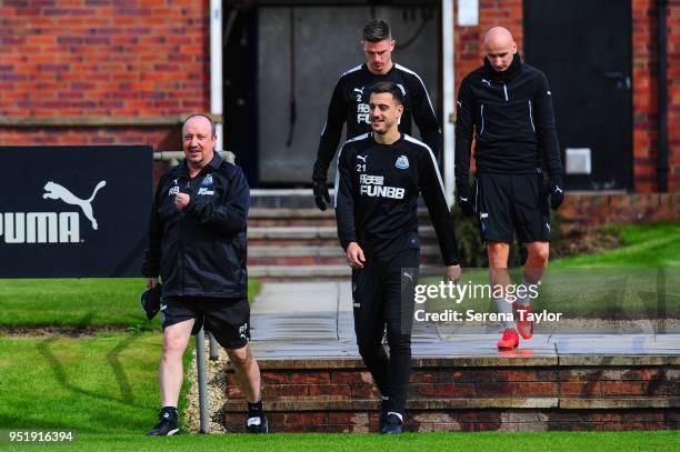 Newcastle United Manager Rafael Benitez walks outside with Joselu, Ciaran Clark and Jonjo Shelvey during the Newcastle United Training Session at the...