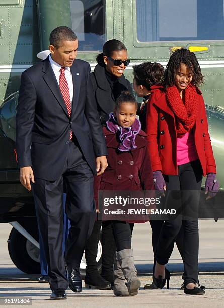 President Barack Obama, First Lady Michelle Obama and their daughters Malia and Sasha arrive to board the Air Force One at the Andrews Air Force Base...