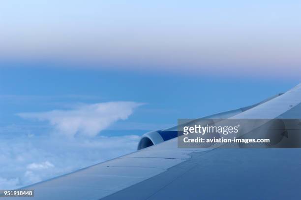 Leading-edge of the wing of a British Airways Boeing 747-400 with clouds before dawn enroute GRU-LHR BA246.