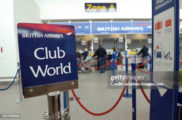 Passengers checking-in at British Airways self-service check-in kiosks managed by Aviance in Manchester Airport Terminal3, IBM series N kiosks.