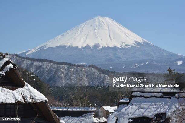 mt fuji and traditional houses - kamal zharif stock pictures, royalty-free photos & images