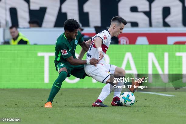 Theodor Gebre Selassie of Bremen and Erik Thommy of Stuttgart battle for the ball during the Bundesliga match between VfB Stuttgart and SV Werder...