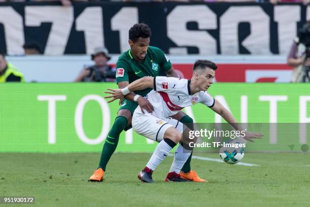 Theodor Gebre Selassie of Bremen and Erik Thommy of Stuttgart battle for the ball during the Bundesliga match between VfB Stuttgart and SV Werder...