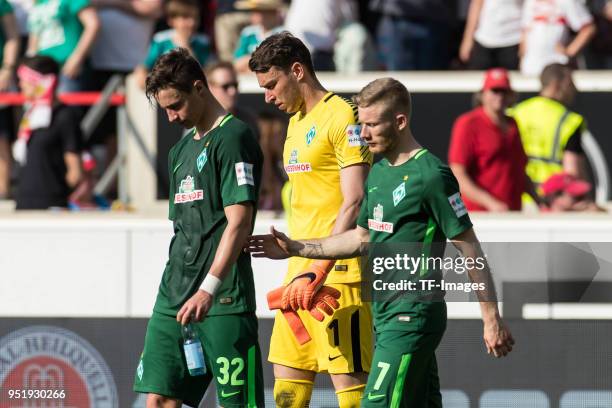 Marco Friedl of Bremen, Goalkeeper Jiri Pavlenka of Bremen and Florian Kainz of Bremen look dejected after the Bundesliga match between VfB Stuttgart...