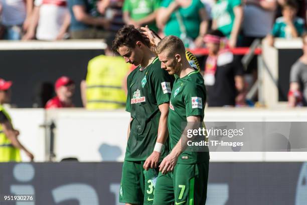 Marco Friedl of Bremen and Florian Kainz of Bremen looks dejected after the Bundesliga match between VfB Stuttgart and SV Werder Bremen at...